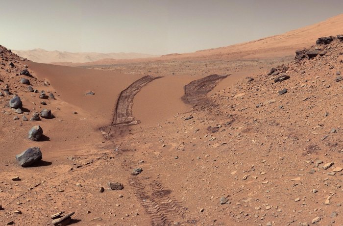 A vehicle lands on mars and explores its surface